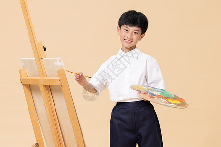 手拿调色盘画画的小男孩暑期生活高清图片素材