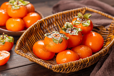 新鲜果实水果篮里的柿子背景