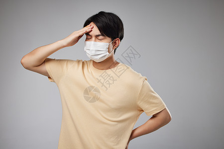 雾霾防护素材戴口罩的男青年头痛背景