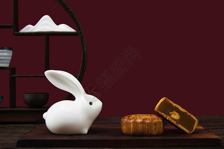 兔子月饼店中秋节月饼和玉兔背景