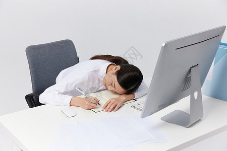 工作趴在桌子上疲惫的职场女性商业高清图片素材