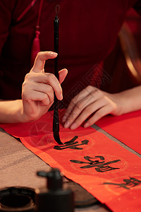 中式服饰纹样女子写对联的特写背景