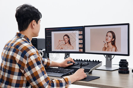 数码办公男性修图师使用调色台办公背景