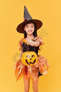小女巫拿着南瓜桶要糖果的女生背景