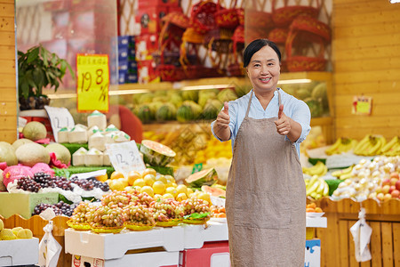 水果店店员点赞形象背景图片