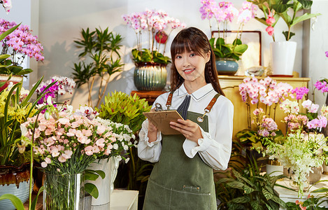 鲜花店折页鲜花店美女销售员手写订单背景