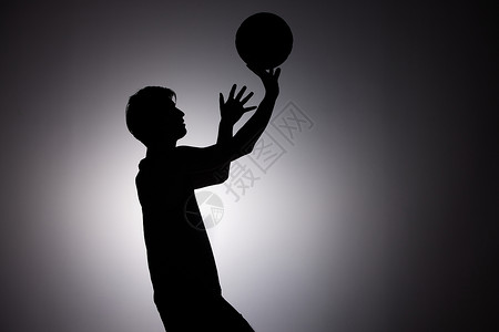 奥运会比赛男性篮球运动员剪影形象背景