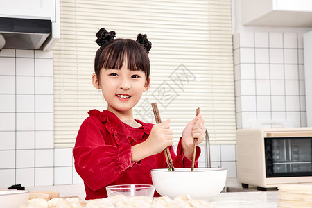 中国传统节气边框女孩在家学习包水饺背景