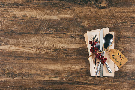 感恩节促销活动木质纹理下的感恩节刀叉背景