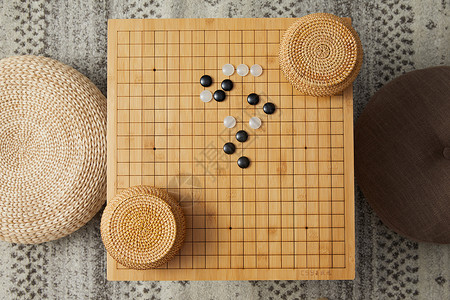 益智类围棋盘上的黑白棋子背景