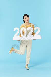 美女欢乐迎接新年2022背景图片