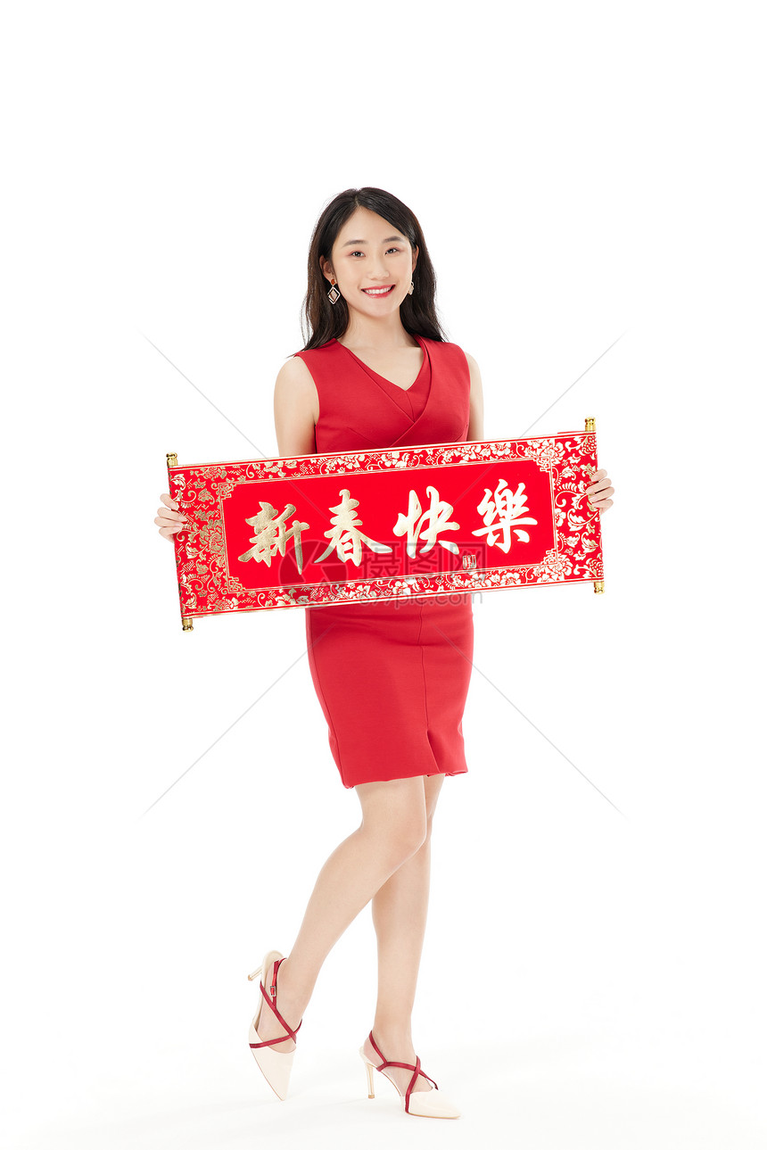 新年女性手拿新春快乐对联图片