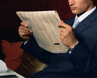 版报纸素材商人阅读财务文件背景
