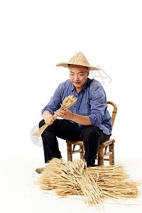 农民拿着水稻形象图片