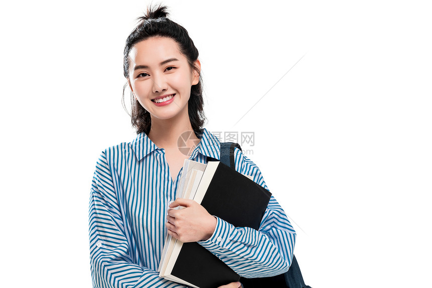 青年人东方能力拿着书本的快乐女学生图片