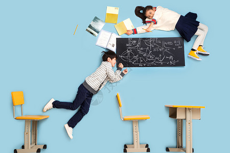 棚拍休闲装飞快乐小学生躺着学数学高清图片