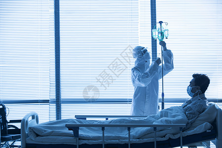 防疫医生和患者在病房里预防新型冠状病毒高清图片素材