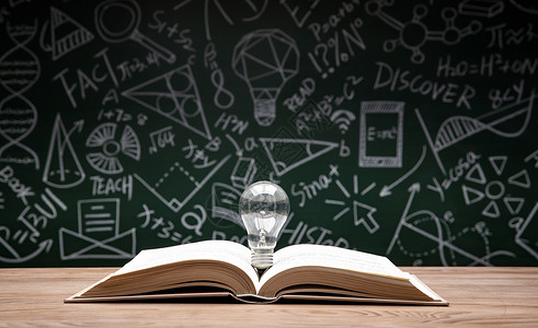 教育灵感黑板画前打开的书和灯泡背景