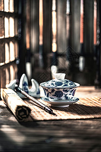 青花瓷元素饮食文化茶杯和文房四宝背景