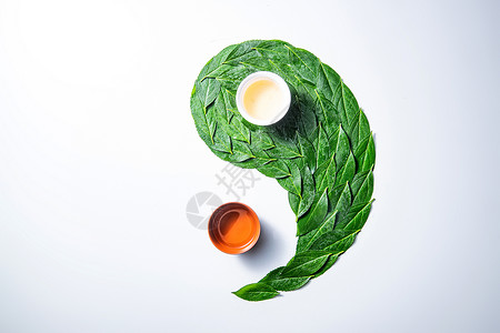 阴阳平衡传统茶叶和茶杯组成的太极图案背景