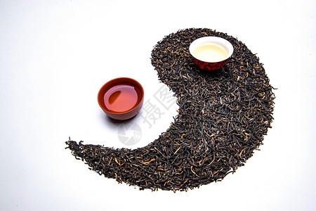 杯子图案影棚拍摄陶瓷制品式样茶叶和茶杯组成的太极图案背景