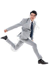 商务男士摄影图摄影成年人全身像奔跑跳跃的商务男士背景