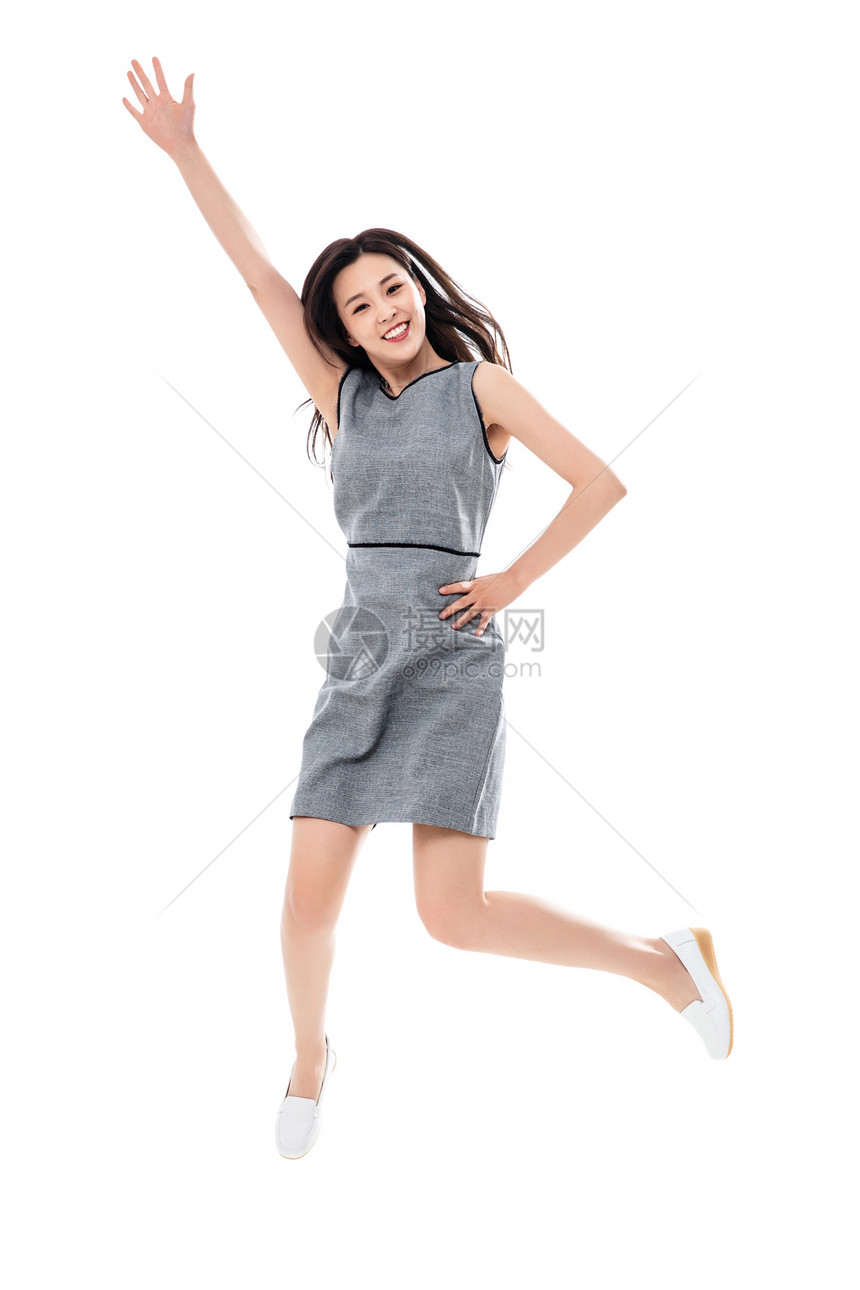 好消息商务人士垂直构图兴奋跳跃的商务女士图片