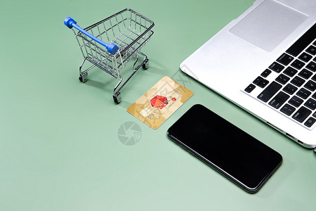 卡小笔记本电脑和购物车模型手机银行卡背景