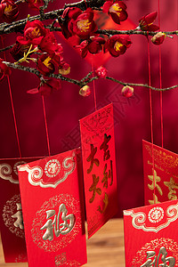 文字古代文明传统悬挂在梅花下面的红包春节高清图片素材