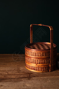 黑色餐盒老式竹条编织食盒背景