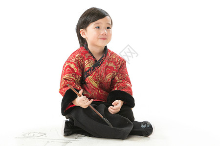 春节画画素材水平构图有趣的可爱的小男孩坐在地上画画背景