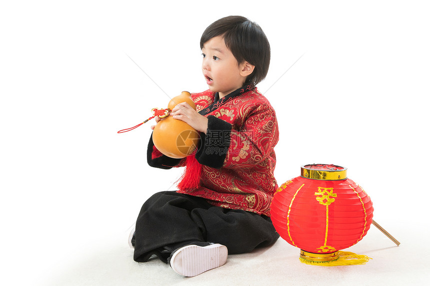 留白春节可爱的小男孩拿着葫芦图片