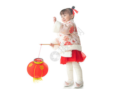 2岁儿童愉悦儿童2岁到3岁一个小女孩手提红色灯笼庆祝新年背景