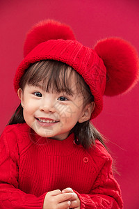 户内传统节日吉祥穿红衣戴红帽的可爱小女孩图片