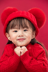拜年有趣的无忧无虑穿红衣戴红帽的可爱小女孩图片