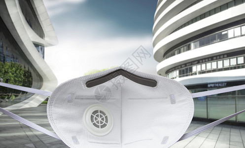 摩天大楼卫生医疗用品城市建筑背景下的口罩图片