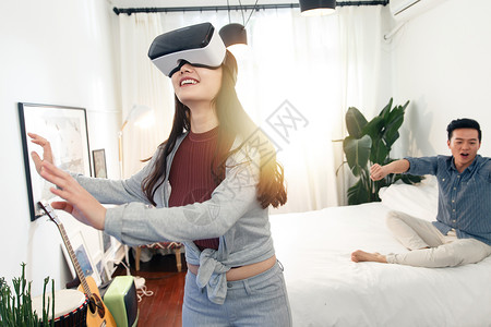 3d灯光素材快乐情侣在室内玩虚拟VR背景