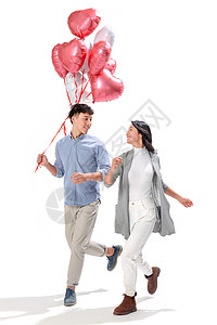 愉悦摄影青年文化浪漫情侣拿着心形气球图片