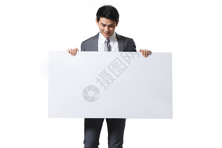 拿着空白栏的人愉悦西装人商务青年男人拿着白板背景