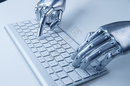 机械手触碰键盘数码科技创新智能机械手与键盘背景