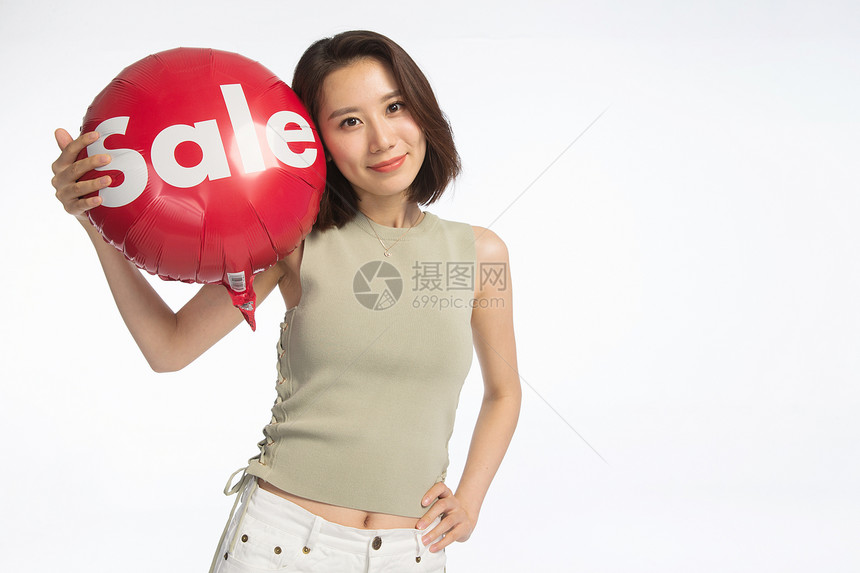 半身像欢乐打折快乐的年轻女孩拿着气球图片