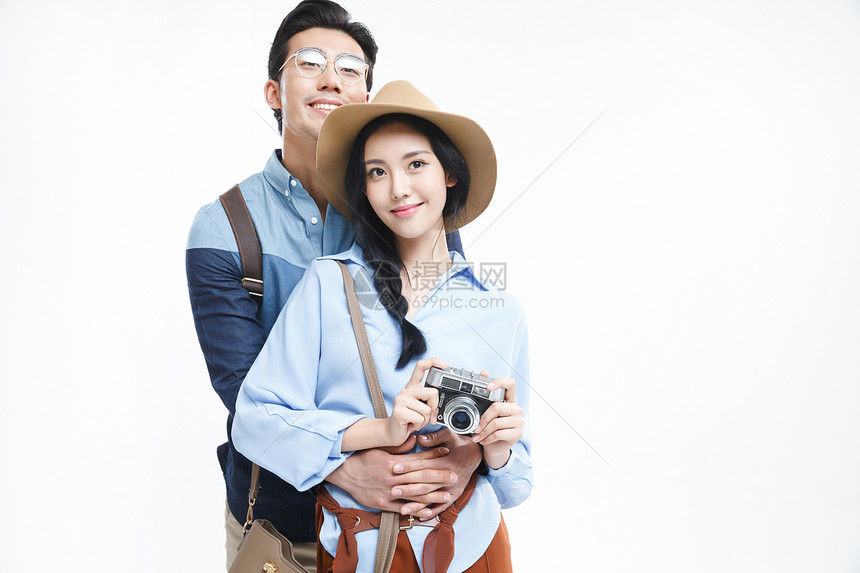 女人东亚影棚拍摄青年情侣旅行图片
