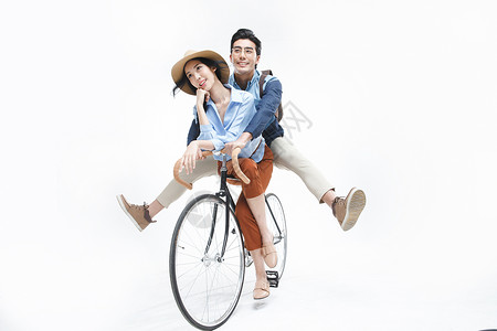 骑独轮时尚动作两个人青年情侣骑自行车背景