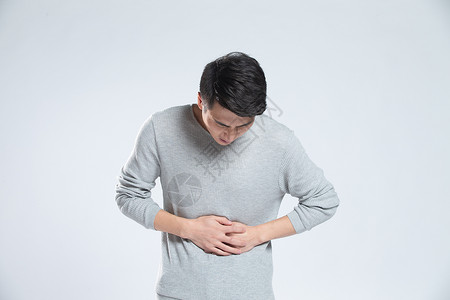 人疼痛胃摄影面部扭曲不舒服的青年男人肚子疼背景