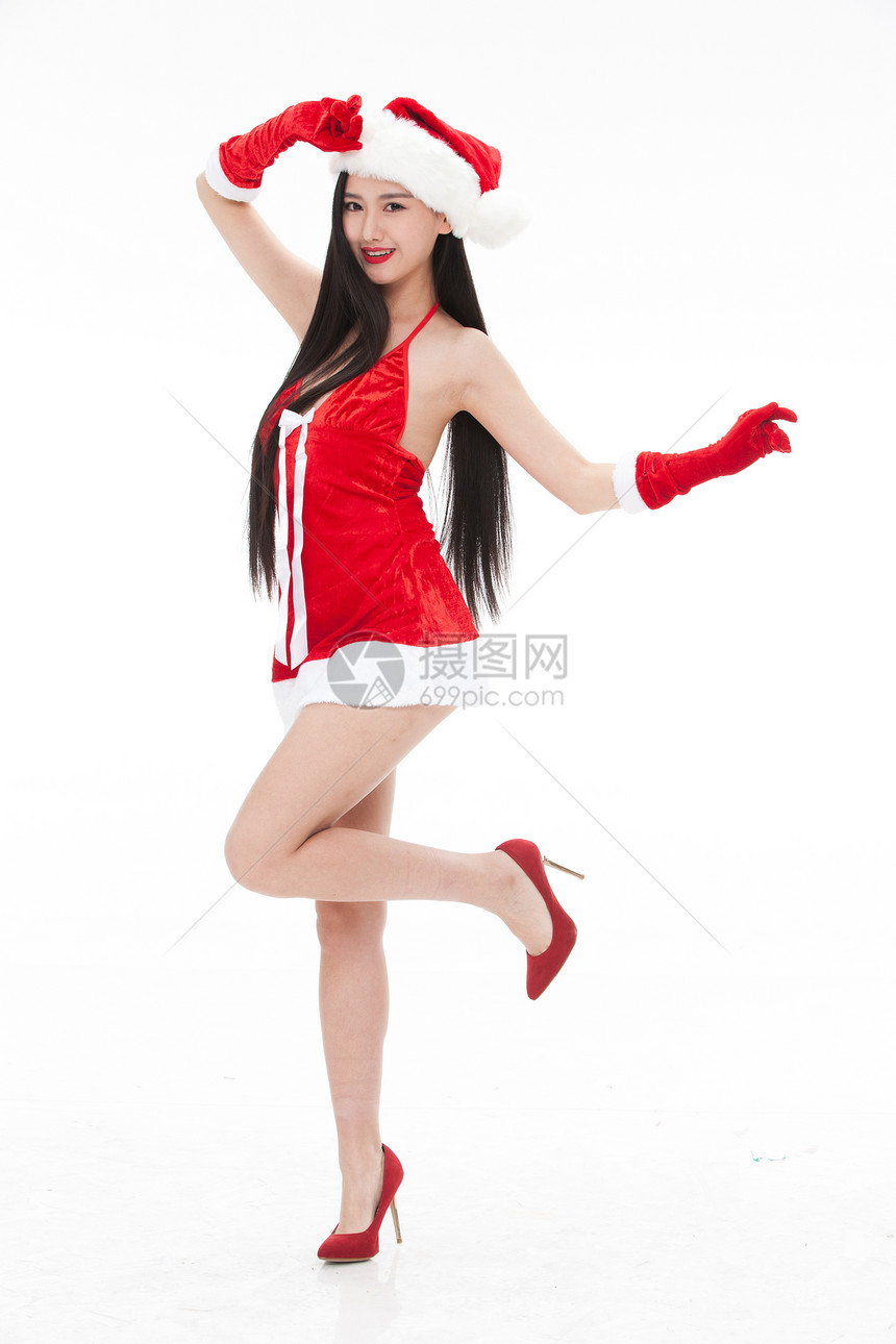 欢乐传统文化穿圣诞服的年轻女人图片