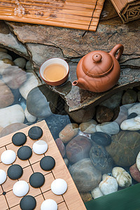 围棋黑子图片棋盘文化彩色图片茶具背景
