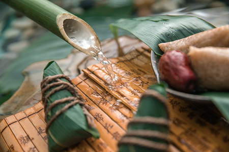 盛水竹筒端午美食粽子背景