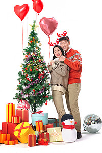 东方人青年女人快乐的青年情侣过圣诞节图片