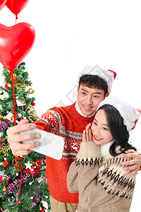 圣诞网红素材青年情侣用手机照相背景