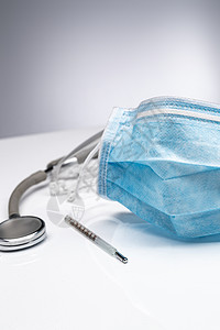 感冒流感病毒防流感口罩防护健康保健一次口罩和听诊器背景